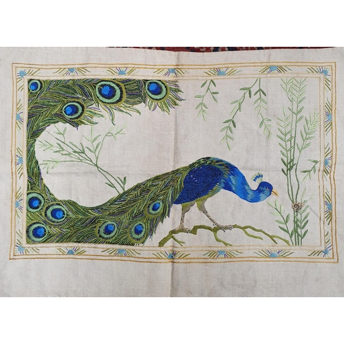 473 - Two colourful needlework Tapestry Panels on linen, one depicting a peacock on a branch the other a l... 