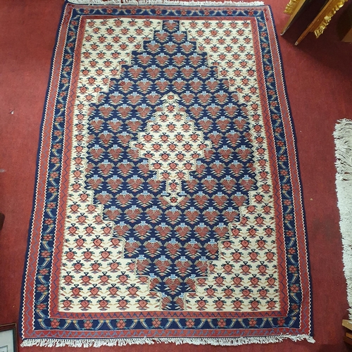 477 - A good Persian Kelim Rug with central ivory medallion and outer dark blue medallion with all over pa... 