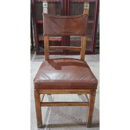 972 - A Brown leather and Oak Chair.