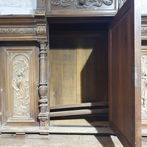 994 - A very elaborately Carved Large Timber Continental Cabinet .