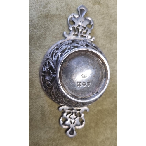 471 - A London Silver Strainer, William Comyns, A Birmingham Silver babies Spoon and Push, a Sheffield Sil... 