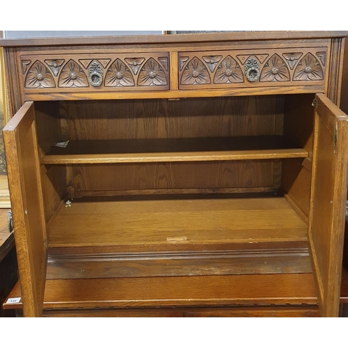 117 - A good Old Charm two door Cabinet with twin frieze drawers over panelled doors. 91 x 48 cm approx.