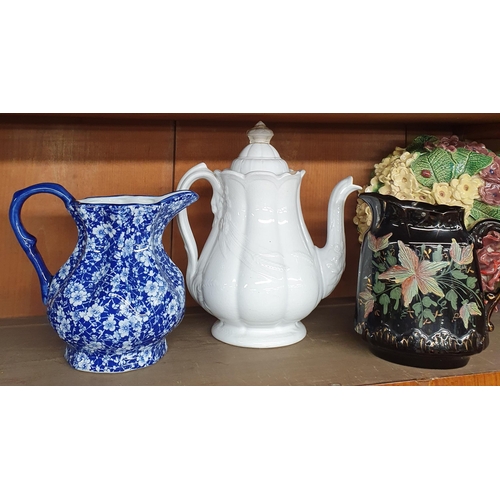 125 - A good Masons Ironstone Jug in the Imari pattern along with a quantity of other jugs etc.