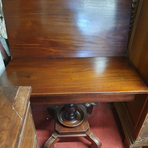 160 - A 19th Century Mahogany Foldover Tea Table on turned supports on unusual platform base. 99 x 94 x H ... 