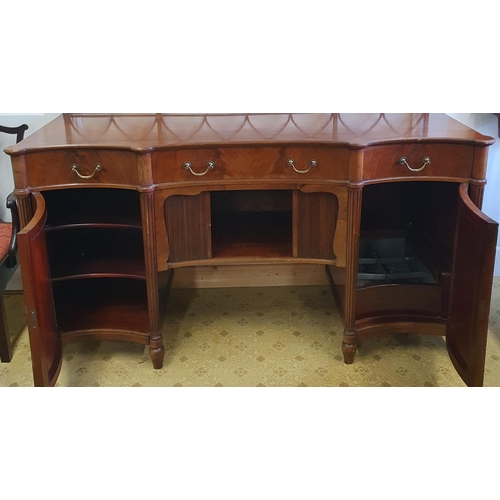 39 - A Fabulous 19th Century Mahogany concave Sideboard with a tambour door and single frieze concave cen... 