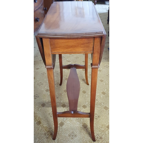 71 - A 20th Century Mahogany Dropleaf Table of neat proportions with square tapered splayed supports and ... 