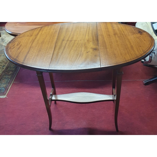 71 - A 20th Century Mahogany Dropleaf Table of neat proportions with square tapered splayed supports and ... 