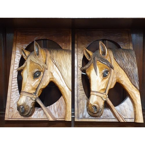 93 - Two hand carved Plaques of horses heads along with a figure of a hound and two brass horses and a sm... 