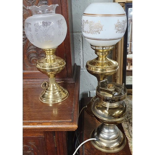 95 - Three Brass electrified oil style Lamps two with glass shades.