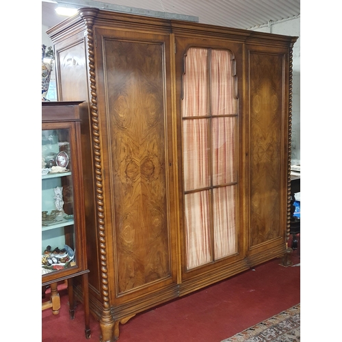 179 - A Fabulous 20th century Walnut and veneered three door wardrobe with fitted interior and glazed cent... 