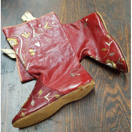 494A - A rare pair of Russian Red leather child's Boots with Gold and Silver threadwork in a floral design.