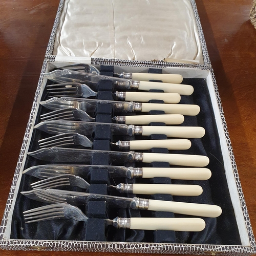 492 - A large 19th Century cutlery case along with a quantity of Flatware.