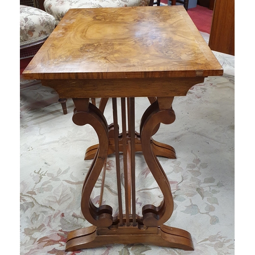 560 - A good Nest of two Walnut and Veneered Tables with lyre end. Largest being 44 x 33 x H 53 cm approx.