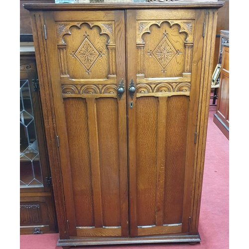 566 - A 20th Century Old Charm two door Linen Press with fitted interior. 95 x 48 x H 151 cm approx.