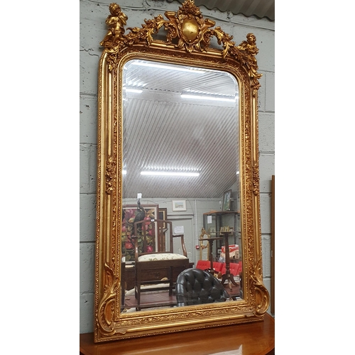 581 - A good Timber and Plaster Gilt Overmantel Mirror with highly carved outline cartouche top depicting ... 