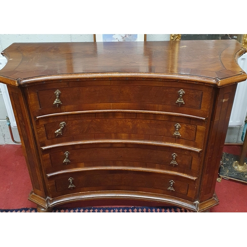 588 - A Mahogany Veneered concave Chest of Drawers with crossbanding & moulded edge to the shaped top, wit... 