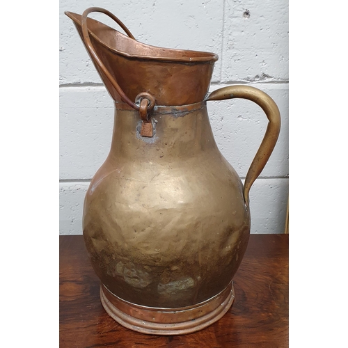 591 - A good large Brass and Copper Pail with copper handle. H 42 cm approx.