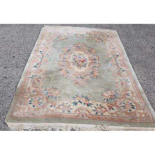 1101 - An Oriental style green ground carpet .
L 290 x W 180 cm approx.