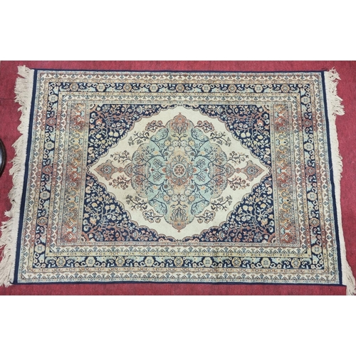 169A - A small Blue ground Rug with multi borders. 147 x 94 cm approx.