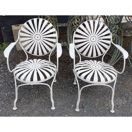 1108 - Two white metal garden Chairs designed by Francois Carre.