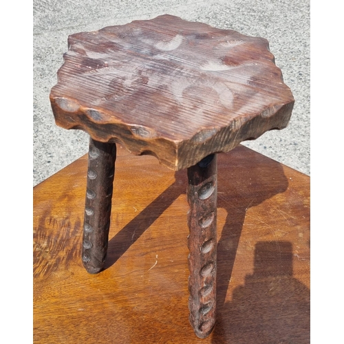 526 - A rustic three legged Stool. W 29 x H 39 cm approx.