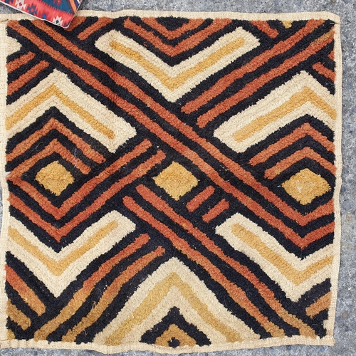 195 - A Group of Rugs , 2 Cushion Covers, 2 non slips under rugs  and a length of red and gold Fabric.