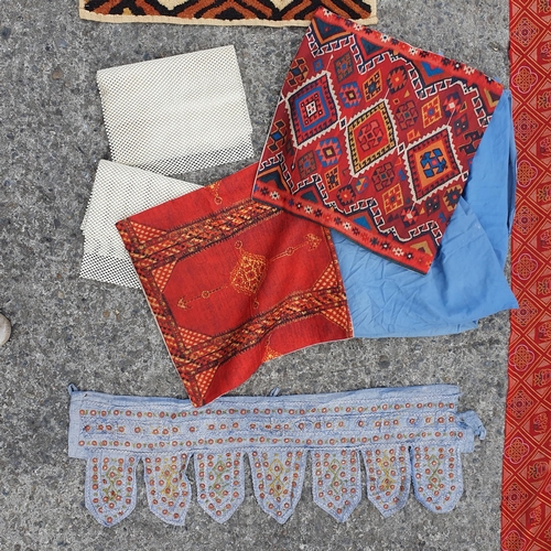 195 - A Group of Rugs , 2 Cushion Covers, 2 non slips under rugs  and a length of red and gold Fabric.