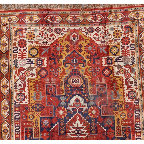 197 - A rust and blue ground Carpet.
L 280 x W 1447 cm approx.