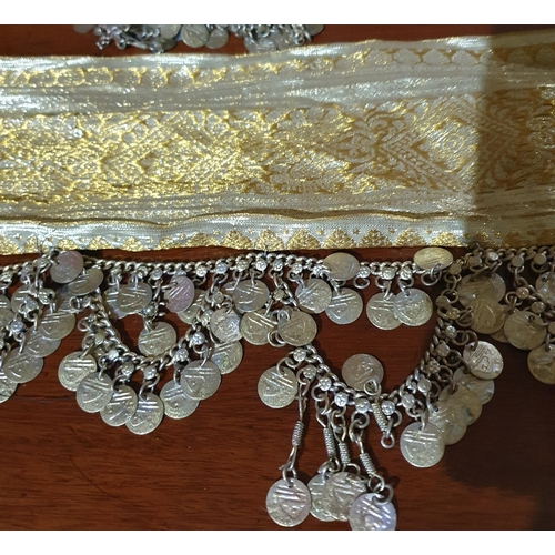 244 - An 8 Meter Length of Gold Ribbon with Decorative Metal coin chain. 7 cm wide .