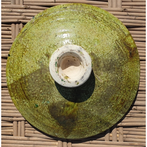 256 - A large Green Pottery Centre Bowl along with a wooden tray.
Diameter 50 cm approx.