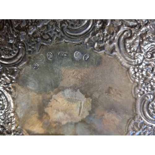 458 - A heavy Irish Silver Salver, William Nolan 1825 with a highly etched outline and crested center. 400... 