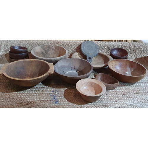 381 - A large quantity of Carved and Turned Wooden Bowls of various sizes.