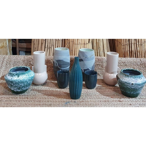 384 - A large quantity of Ceramic and Porcelain vases and Bowls as new ,many as pairs.