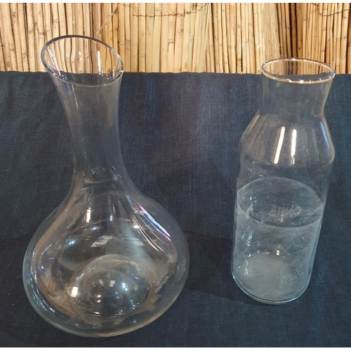 397 - A tall Glass Vase along with 3 fish bowl vases , a Wine Decanter and other items. H 40 cm approx.