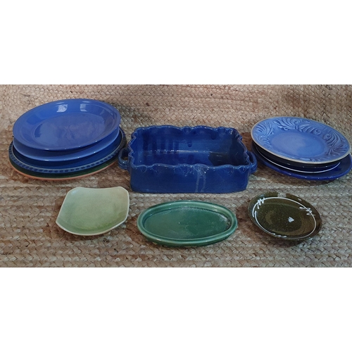 399 - A large selection of serving dishes , lidded pots, Bowls and ceramic Plates .