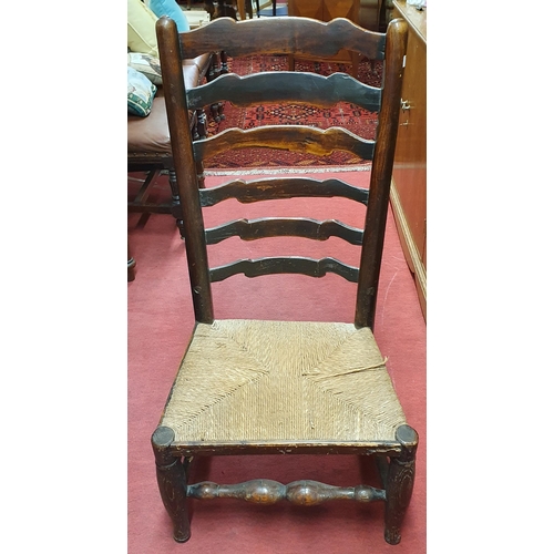 18 - A 19th Century provincial ladder back Chair with rush seat. W 50 x SH 30 x BH 96 cm approx.