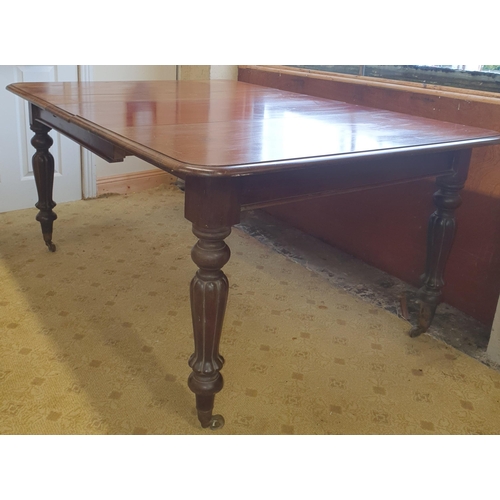 50 - A lovely early 19th Century Mahogany single leaf Dining Table on turned reeded and fluted supports a... 