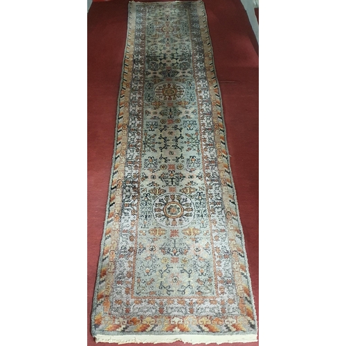 181 - A good green ground Runner with aesthetic movement design and multi borders. 320 x 70cm approx.