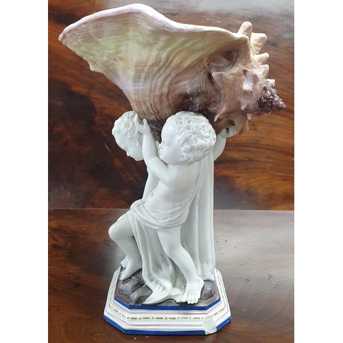 208 - A good Parian Ware Figure of a Cherub holding up a shell along with a single hand painted candlestic... 