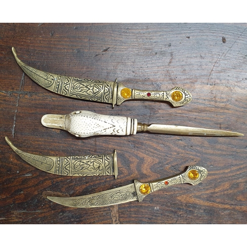 213 - Two Brass Daggers along with an ivorine handled letter opener.