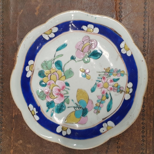 216 - An early Oriental Dish with hand painted decoration of flowers and butterflies along with three othe... 