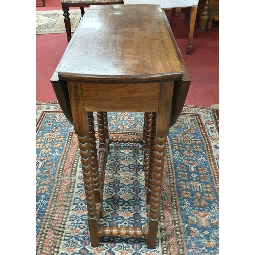 232 - A 20th Century Rosewood bobbin shaped miniature Dropleaf Table with mother of pearl inlay decoration... 