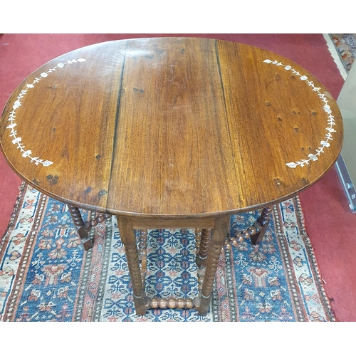 232 - A 20th Century Rosewood bobbin shaped miniature Dropleaf Table with mother of pearl inlay decoration... 