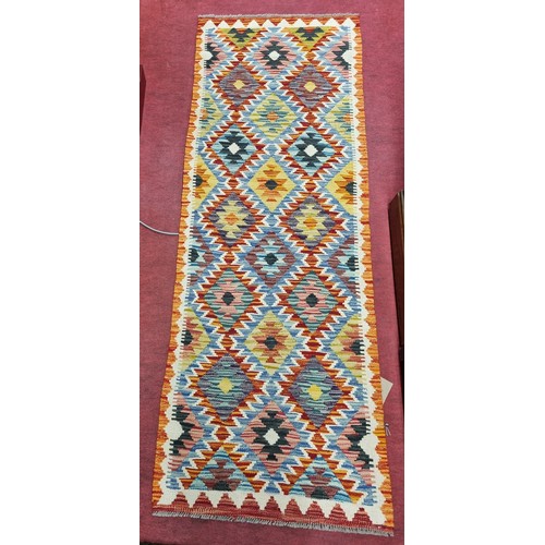 240A - A Chobi Kilim Runner with a colourful repeating small diamond pattern. 197cm 69cm approx.