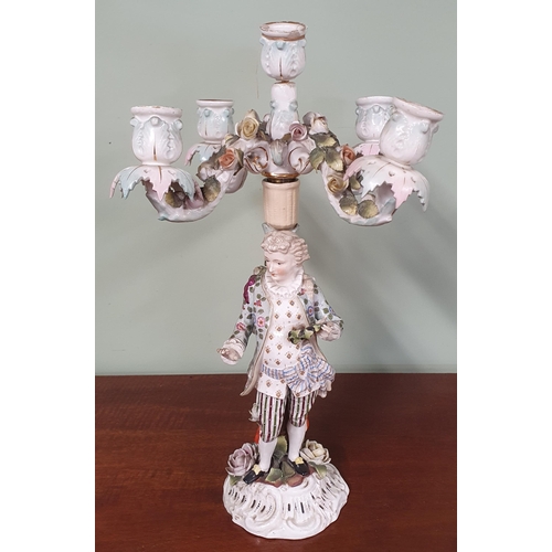 242 - A German Porcelain four branch Candelabra. (slight damage). H 41 cm approx.