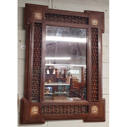 259 - An Aesthetic Hardwood Timber Mirror with latticework detail. 76 x 56 cm approx.