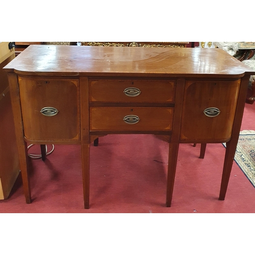 282 - A late 19th Century Mahogany and crossbanded Sideboard with twin drawers flanked by single doors on ... 