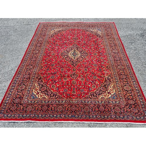 1043 - A fabulous rich Red ground Iranian Red ground Carpet Carpet with a trditional medallion design from ... 