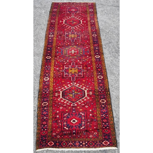 1049 - A good rich Red ground Iranian Runner from the northern Iranian region of Heriz.  336 x 98 cm approx... 