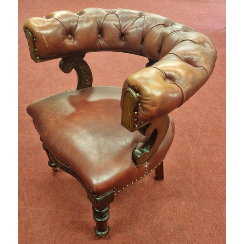 1448 - An Early 19th Century Mahogany Library Chair with deep buttoned Leather upholstry.